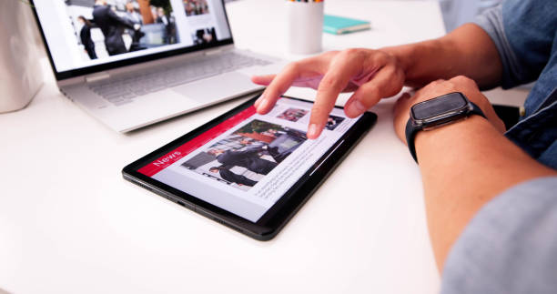 istock Watching News Online,Reading Digital Newspaper 2169373916