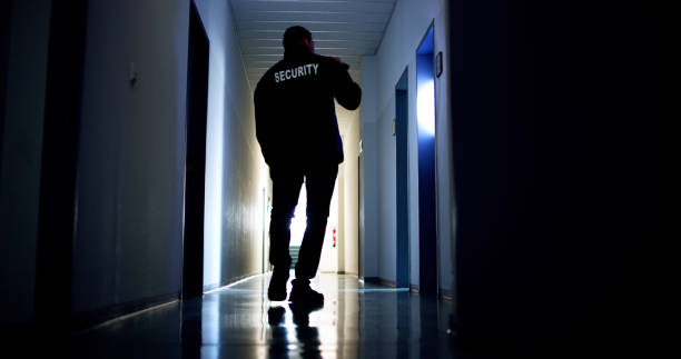 istock Security Guard Standing In Corridor Of The Building 2169374262