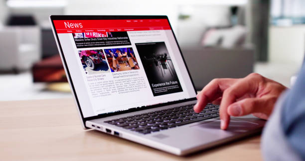istock Watching News On Screen. Reading Newspaper Website 2169374351