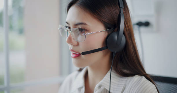 istock Customer service agent is providing advice to a customer calls at a call center. 2169375115