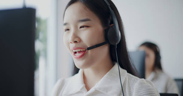 istock Customer service agent team is providing advice to a customer calls at a call center. 2169375155