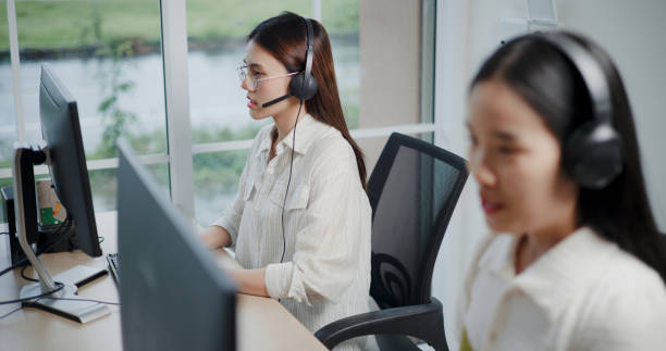 istock Customer service agent team is providing advice to a customer calls at a call center. 2169375267