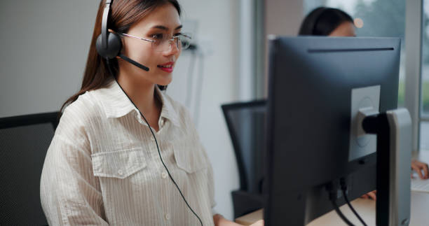 istock Customer service agent team is providing advice to a customer calls at a call center. 2169375301