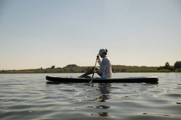 istock Serene Paddleboarding on a Calm Lake 2169382100