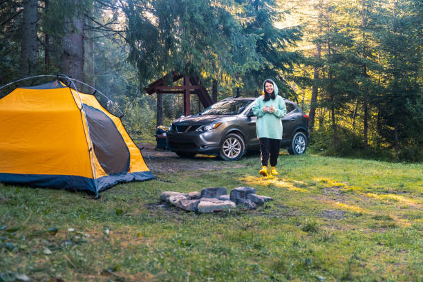 istock Camping by the Fire in a Serene Forest 2169382110
