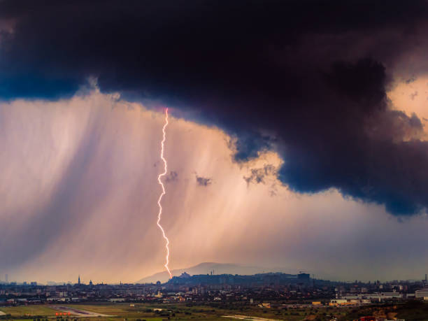 istock Extreme weather, supercell storm clouds over Cluj city, dramatic huge thunderbolt 2169384098