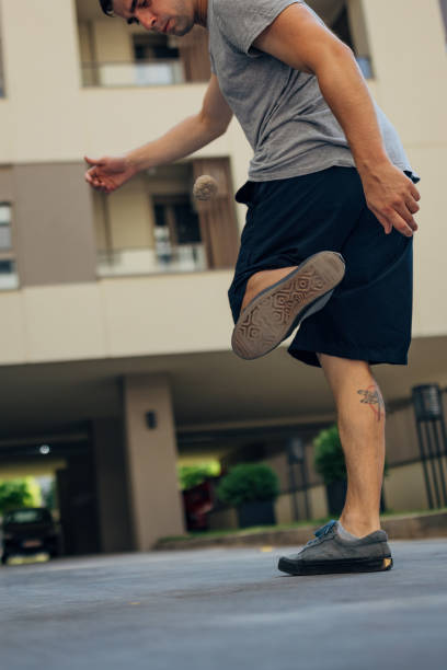 istock The man is focused on balancing and throwing the footbag 2169387263
