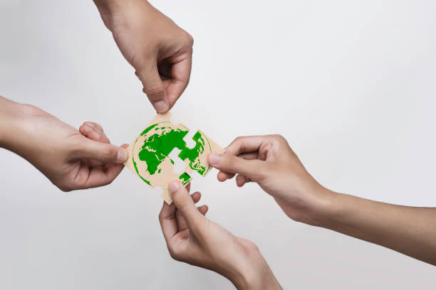 istock World environment day. Business, corporate and community cooperation for environment sustainable development goal. group of volunteers help solve environmental problems. global teamwork and business. 2169388821