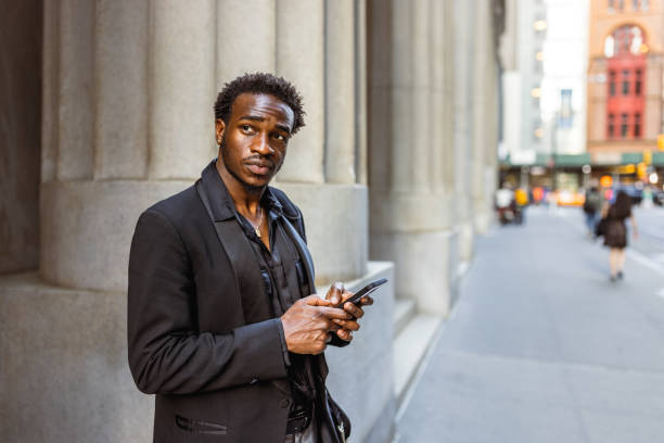 istock Urban Professional Using Smartphone in Downtown Morning 2169394001