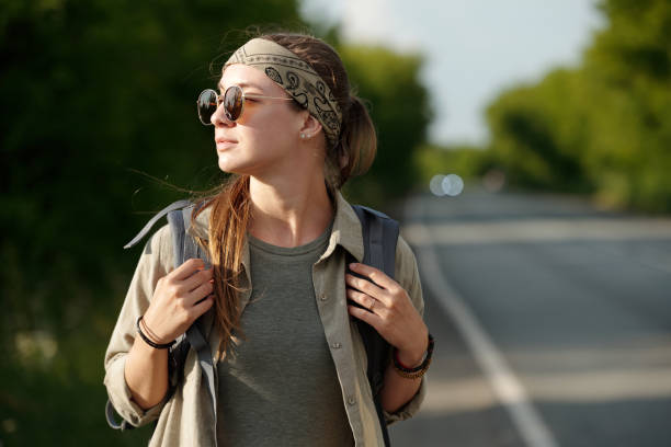 istock Young female freedom lover with backpack 2169394587