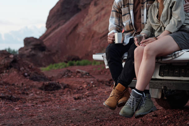 istock Young restful couple with metallic mugs 2169394698