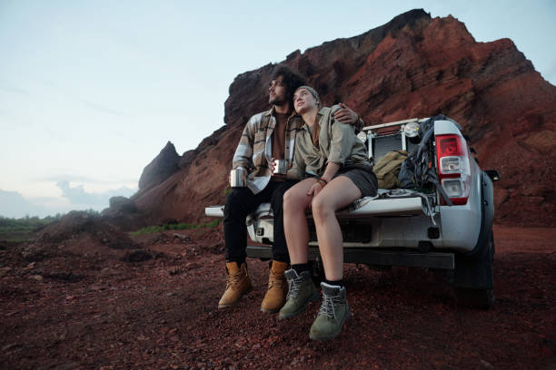 Young restful travelers having tea
