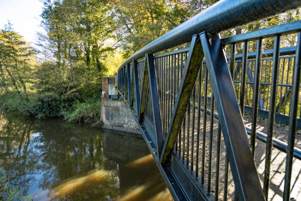 istock Single bridge on the river Wey Surrey England 2169396826