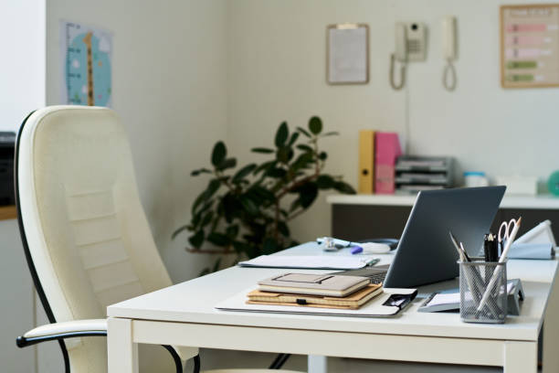 istock Modern Workspace with Organized Desk and Office Chair 2169401833