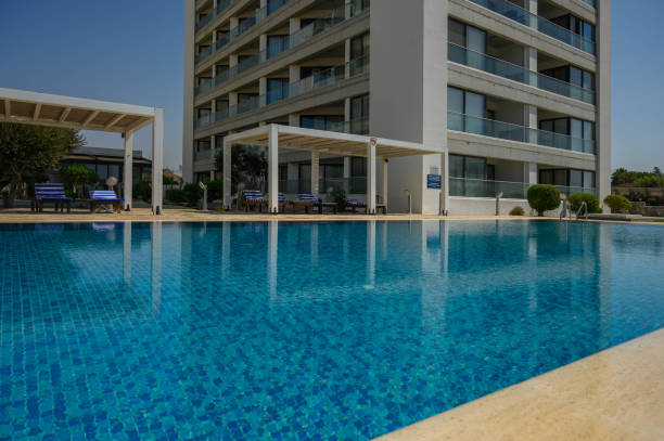 istock Swimming pool near a private modern house against a blue sky 2169403264