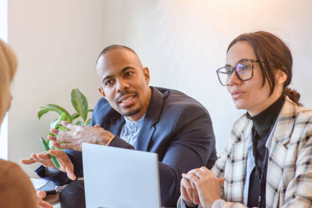 istock Two business people listening to a customer 2169403790