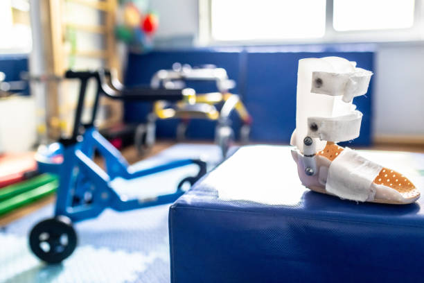 istock Focus on innovative rehabilitation devices for children, showcasing a supportive boot and mobility aids in a therapy setting 2169405252
