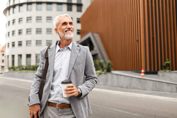 istock Businessman with Coffee, Walking the Streets 2169408418