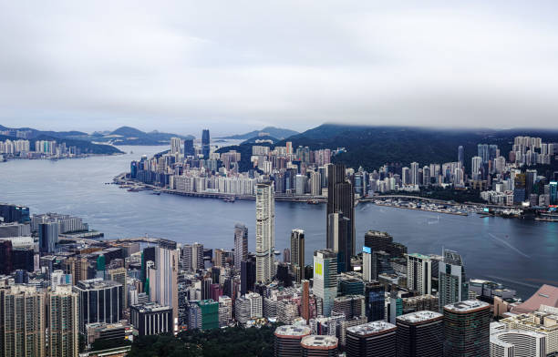 istock Victoria Harbour in Hong Kong under the clouds 2169408759