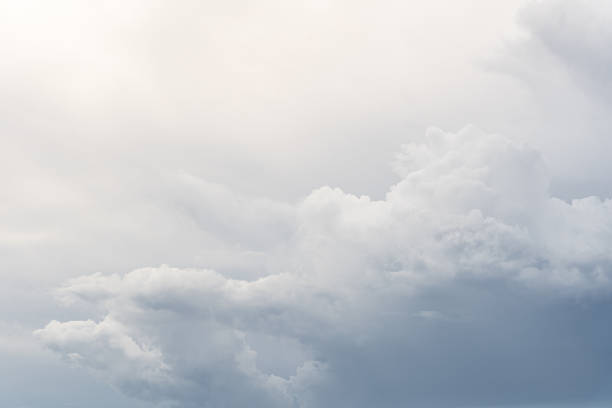 Gray clouds in the sky blocking the sun.