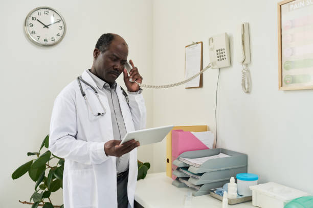 istock African American Doctor Using Tablet in Office Setting 2169413598