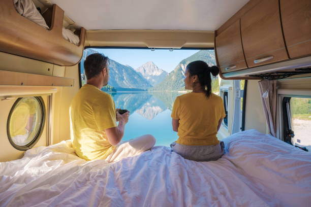 istock Enjoying serene mornings with a stunning view in Plansee Austria from a cozy camper van 2169413702