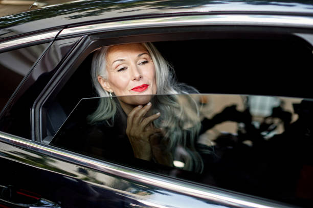 Celebrity looking out car window upon arrival at event