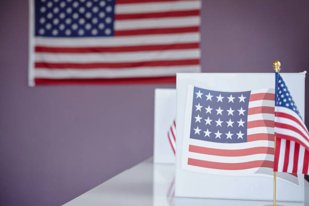 istock American Flag And Banner In Voting Place 2169416843