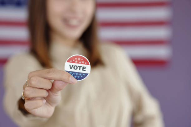 istock Young Voter With Patriotic Pin 2169416845