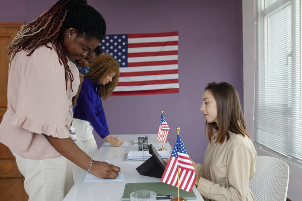 istock People Filling Questionnaires During Election Day 2169417652