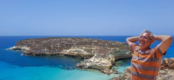 istock Man Enjoying Stunny Seascape 2169418738
