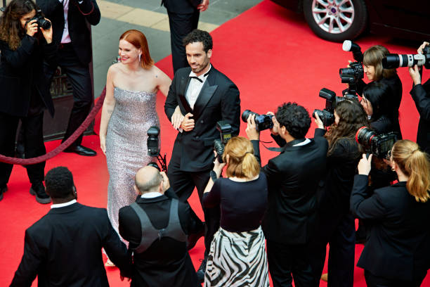 istock Celebrities arriving at glamorous red carpet event 2169419131