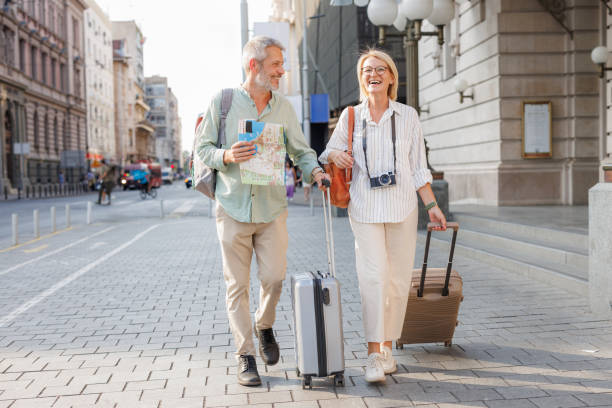 istock Joyful mature couple exploring the city on vacation 2169421208