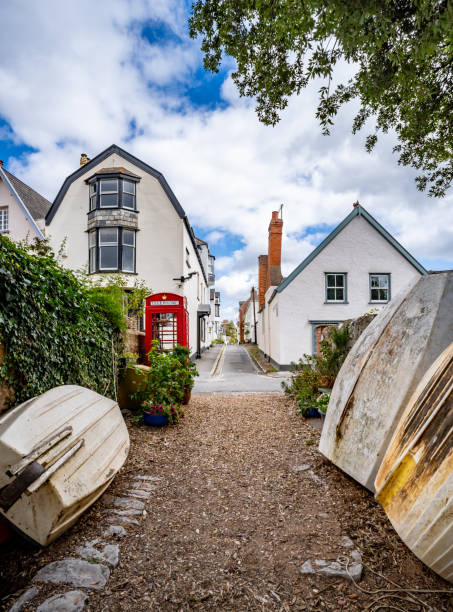 istock Row boats stacked by an on old telephone box 2169426949