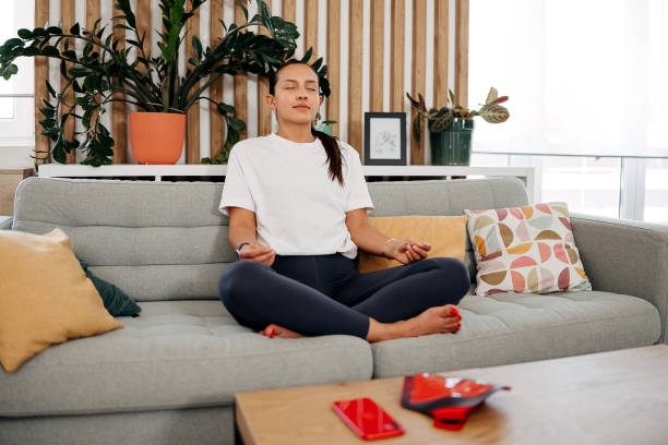 istock Woman doing yoga at home 2169431861