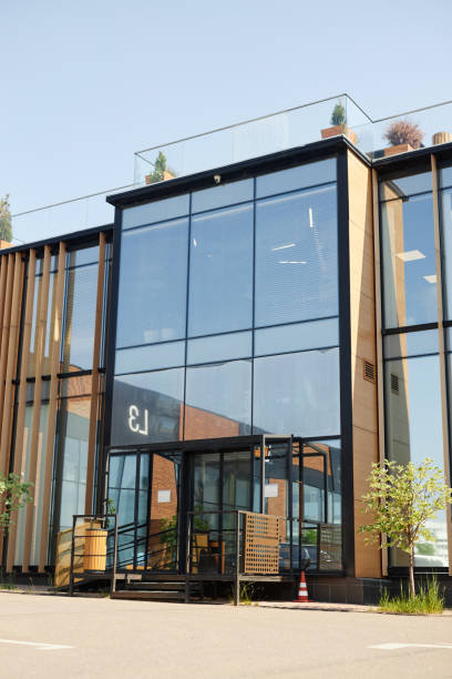 istock Modern Building Entrance with Glass Facade and Wooden Elements 2169432649