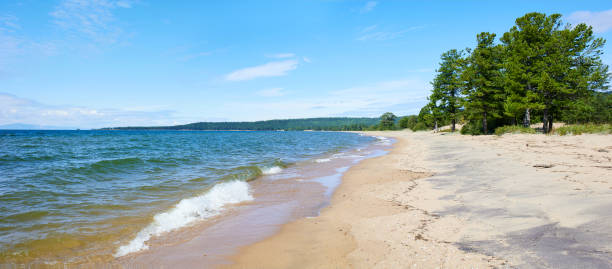 Beautiful sandy beach on a sunny summer day, seascape.