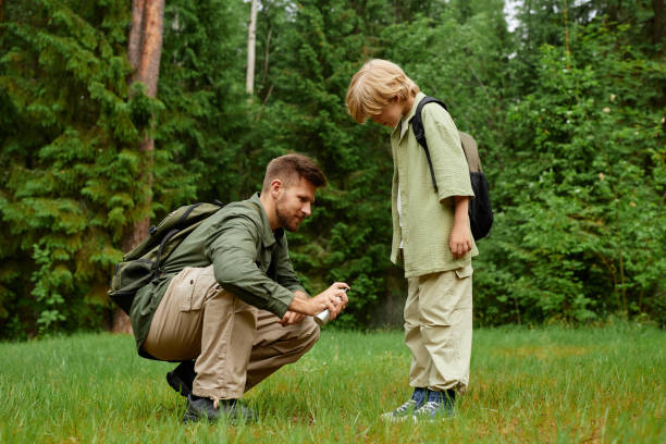 istock Exploring Nature in Forest Moment Between Father and Child 2169434150