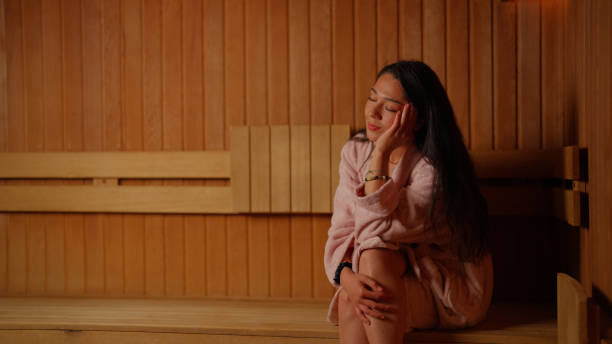 istock Young woman enjoying sauna 2169434366