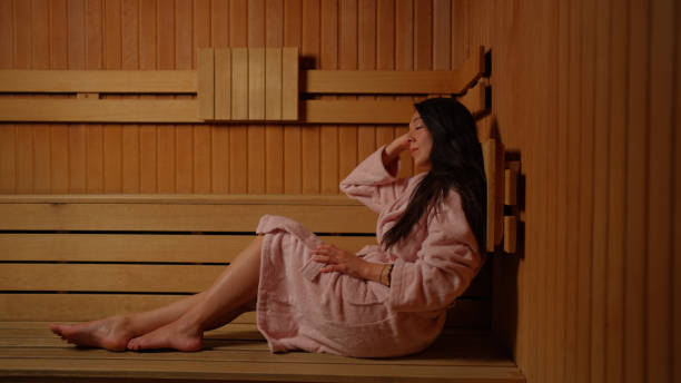 istock Young woman enjoying sauna 2169434436