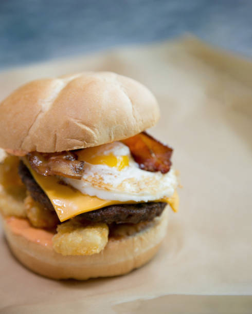 istock Breakfast slider sandwich with egg, bacon, sausage, cheese, and tater tots 2169438435