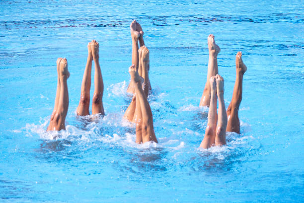 istock Artistic swimmers team performing synchronized legs choreographed movement in the swimming pool 2169442214