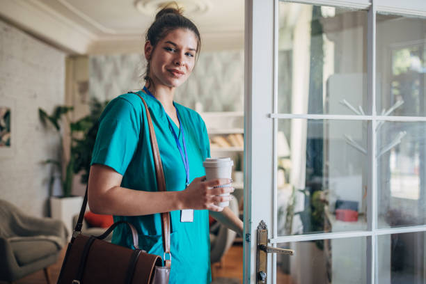 istock Nurse in Green Scrubs with Coffee Cup, Ready to Start Her Day 2169442667