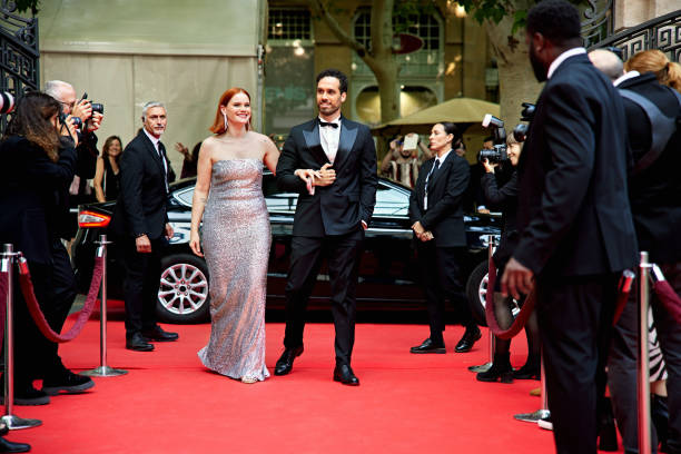 istock Celebrity couple arriving at red carpet event 2169446562