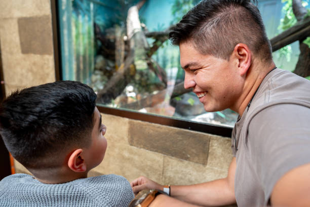 istock Father and son enjoying aquarium 2169448706