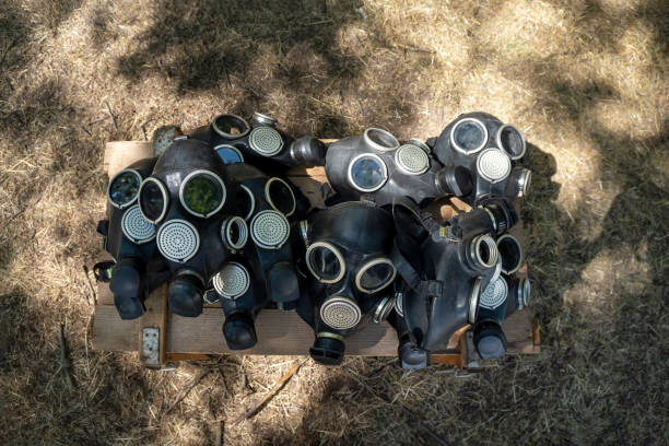 Gas masks lie on the surface. Combat exercises
