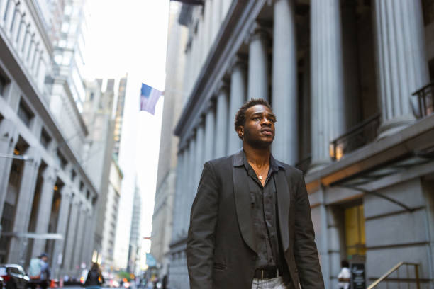 istock Man Walking Through a Historic City Street 2169448997