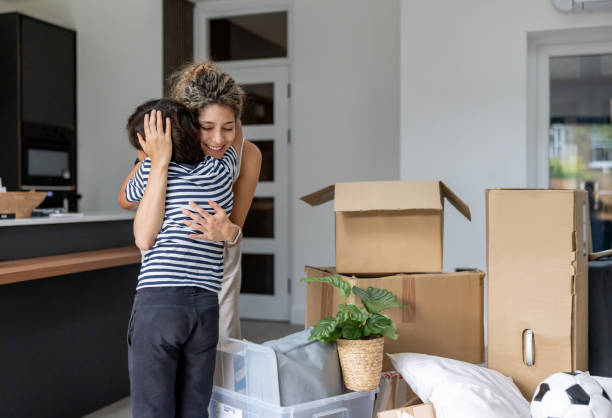 istock Loving mother hugging her son while moving house 2169450218
