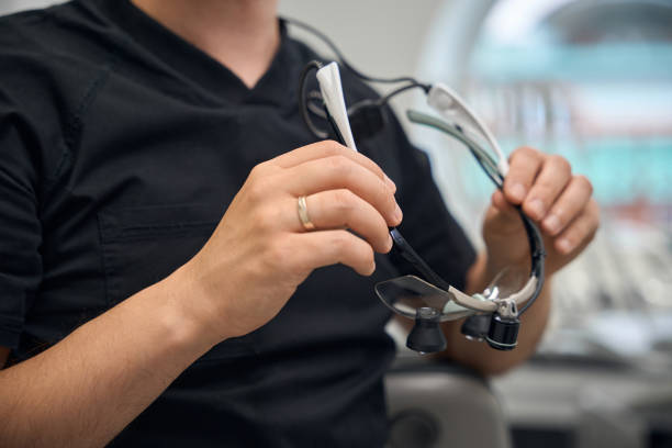 istock Doctor is holding special binocular dental glasses 2169451770