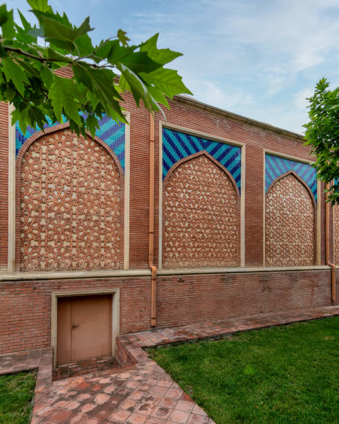 istock Beautifully Crafted Traditional Brick Wall With Geometric Patterns and Vibrant Tiles in a Serene Garden 2169452009